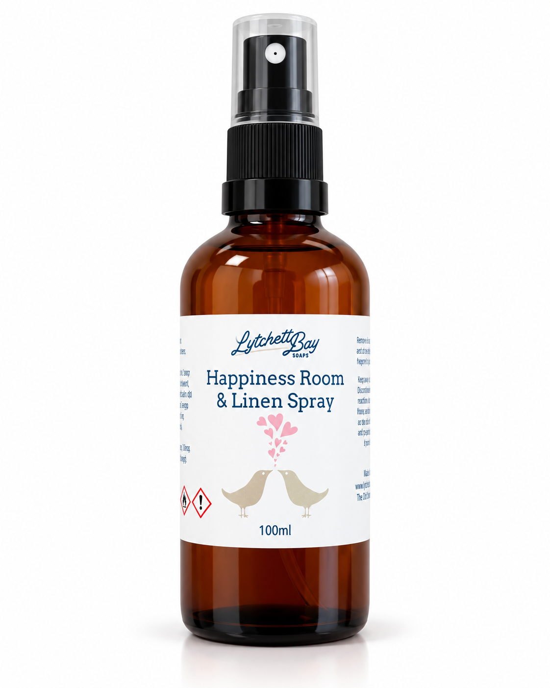 Lytchett Bay Soaps Happiness Room & Linen Spray 100ml in an amber spray bottle, fragranced with Patchouli, Ylang Ylang, Frankincense and Orange essential oils.